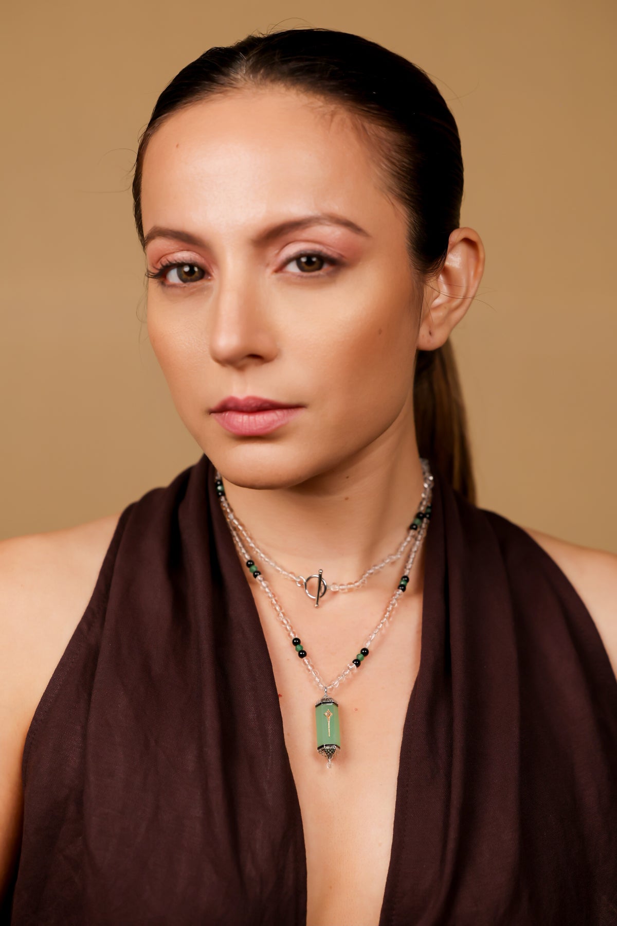 Altair Pendant worn solo over a monochrome look, letting the aqua onyx stand out