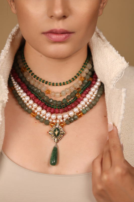 Close-up of the layered strands on the Anuradha Necklace showing aventurine, quartz, onyx, and pearl beads