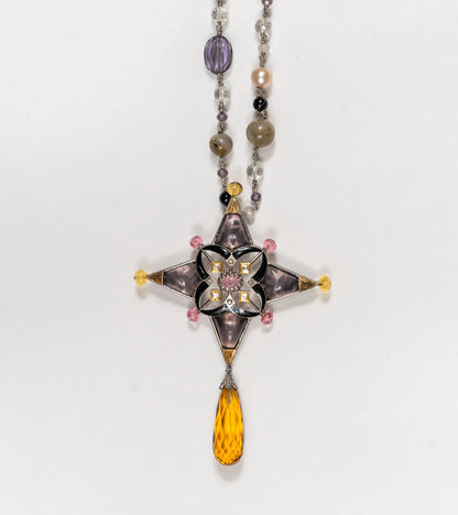 Detail of the beaded chain of pearls and natural stones on the Aashka Necklace, finishing in a topaz drop