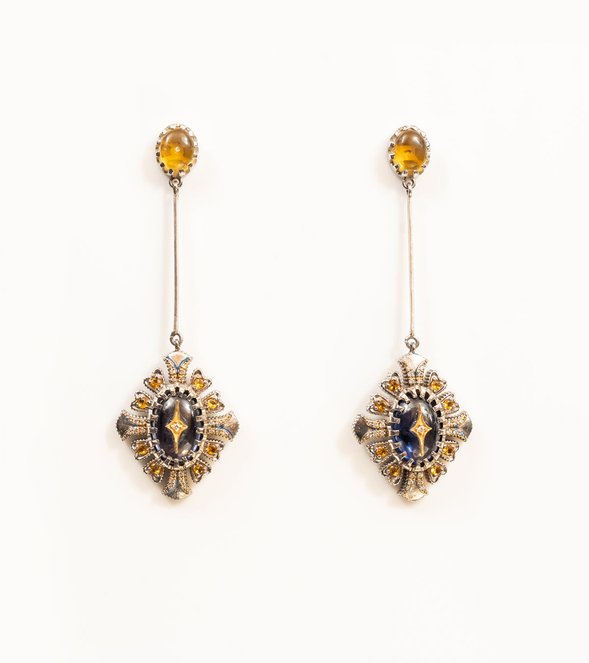 Ada Earrings with a crafted topaz stud, long silver bar, and diamond-shaped pendant in blue kyanite, topaz, and diamonds, with blue hand-painted enamel