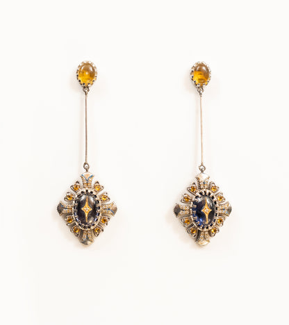 Ada Earrings with a crafted topaz stud, long silver bar, and diamond-shaped pendant in blue kyanite, topaz, and diamonds, with blue hand-painted enamel