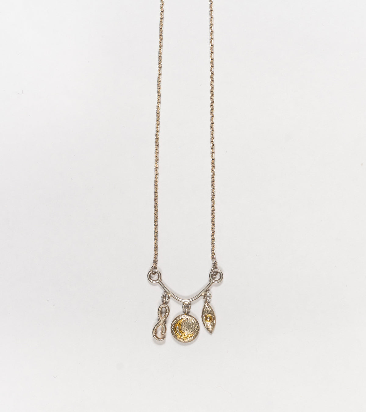 Detail of the Polki diamond accents on the Ari Necklace charms