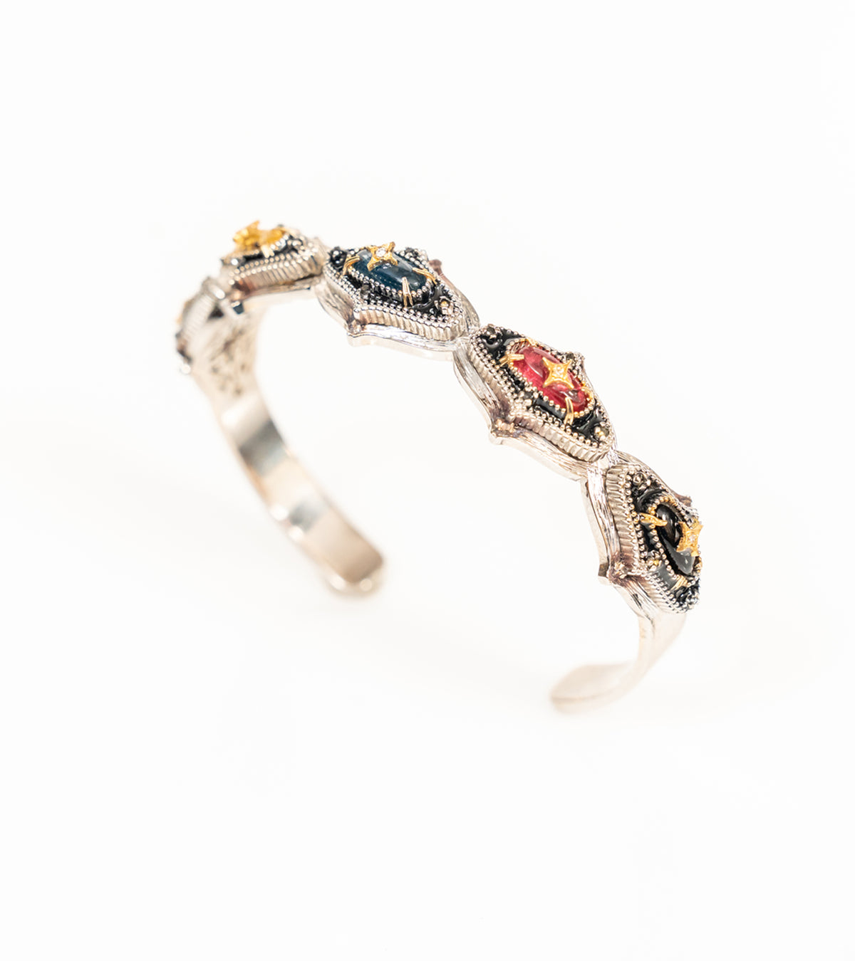 Bombay Slim silver cuff bracelet set with cabochon stones in petal-shaped milgrain settings, featuring natural diamonds and 18K gold accents