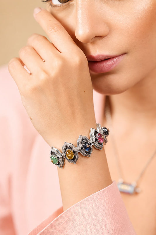 Close-up of the Bombay Stack Bold cuff highlighting natural aventurine, black onyx, crafted topaz, kyanite, rose crystal, and citrine cabochons