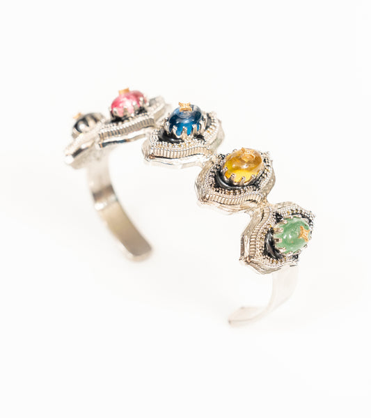 Bombay Stack Bold cuff bracelet in black hand-painted enamel featuring large cabochon stones, pronounced milgrain detailing, natural diamonds, and 18K gold accents