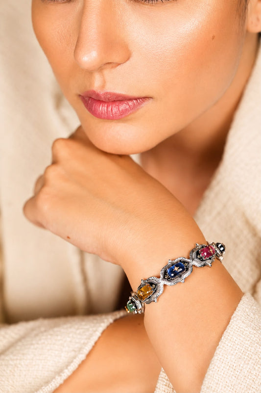 Side profile of the Bombay Stack Classic cuff showing its silver band and natural diamond accents