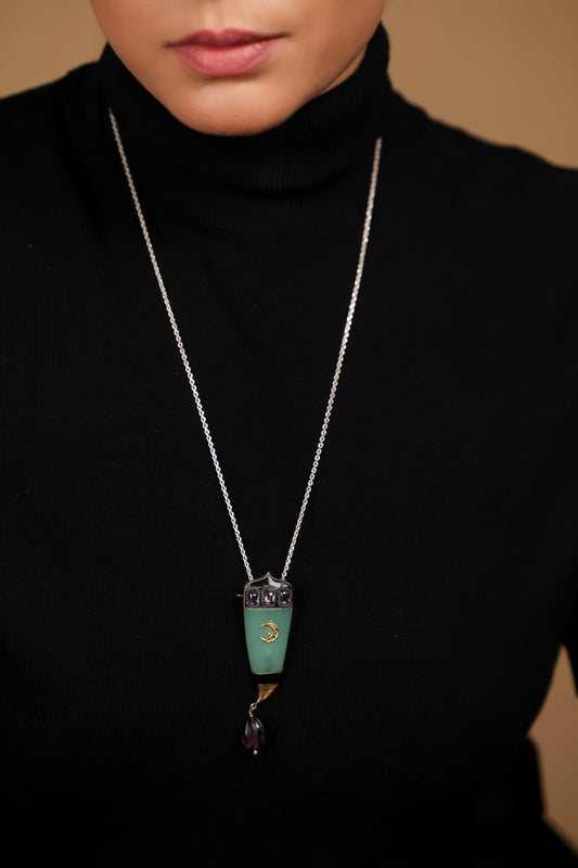 Close-up of the green onyx and amethyst crystal detailing on the Clio Brooch