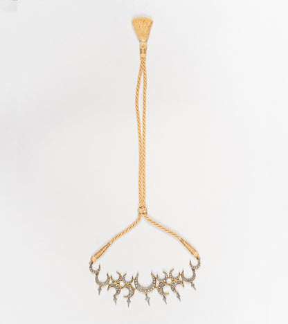Side profile of the Icra Choker showing its structured silhouette and enamel-detailed silver work