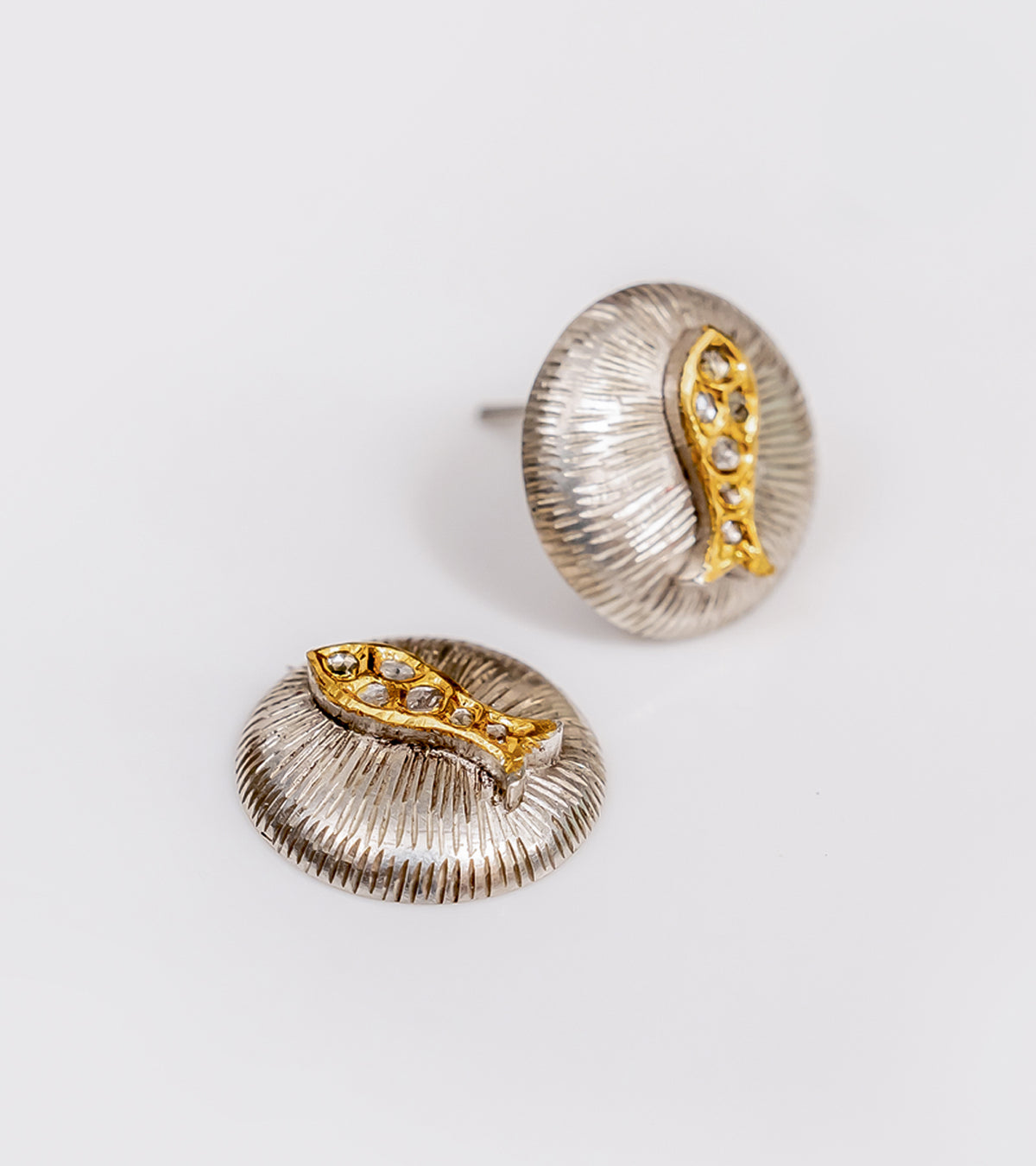 Detail of the fine gold accents on the Nox Earrings' silver setting