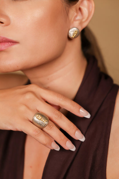 Nox Earrings worn alone, paired with a statement ring for an elevated look