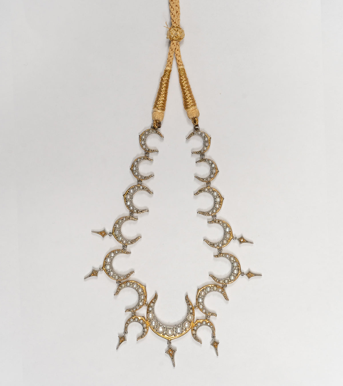 Detail of the delicate China pearls and diamond accents on the Ragini Necklace