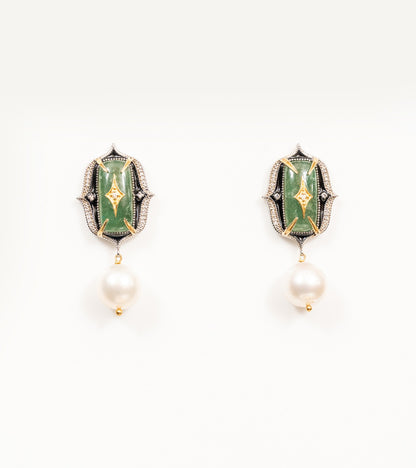 Close-up of the green stone and diamond detailing on the Rewa Earrings' green colorway