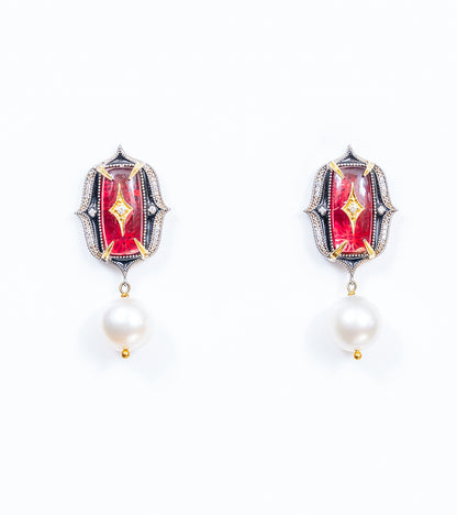 Rewa Earrings in silver with 18K gold accents, rose crystal stones, FG VS diamonds, black enamel, and South Sea pearl drops