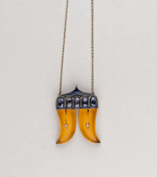Rio Pendant inspired by the double Vagh Nakh motif, handcrafted in sterling silver with 18K gold accents, natural diamonds, and blue hand-painted enamel