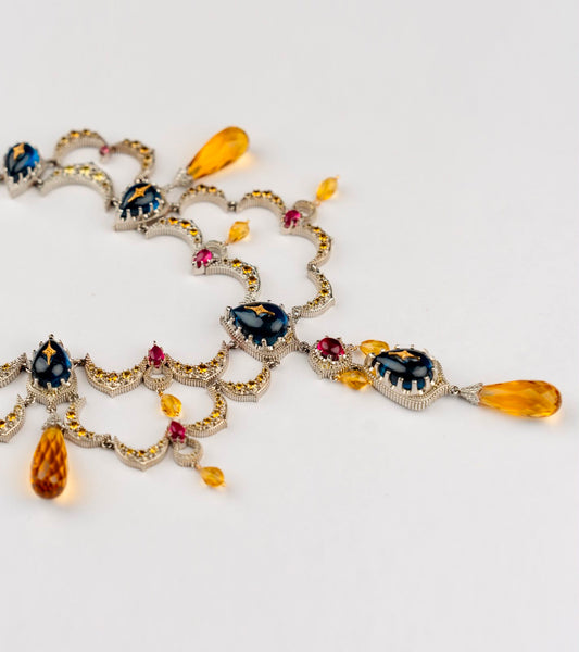 Sara Necklace crescent moon collar in deep blue kyanite with diamond milgrain, ruby accents, and citrine briolette drops, from the Shashikala collection by UBAA