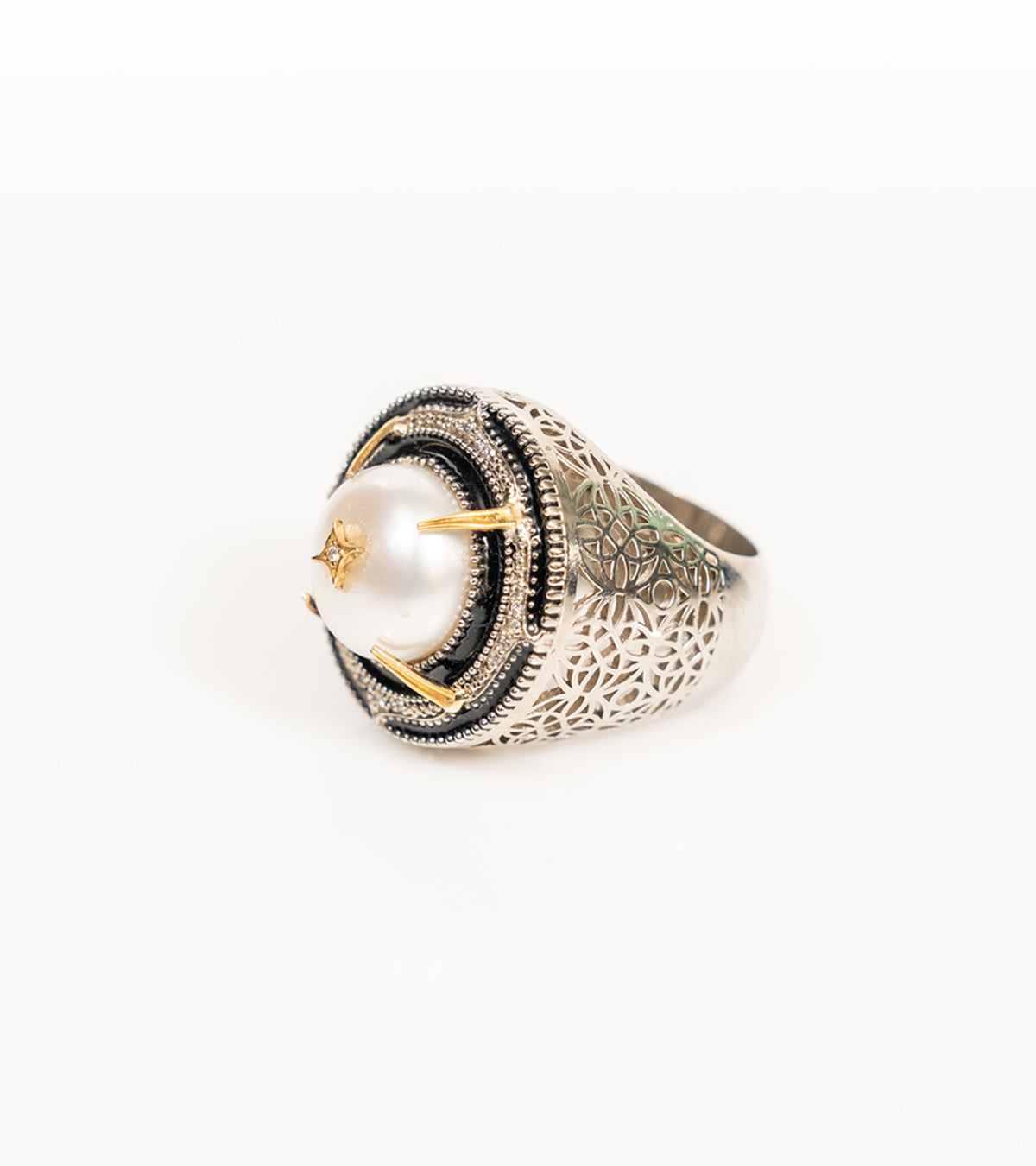 Shakuntala Ring with a South Sea button pearl framed by natural diamonds, sterling silver, and 18K gold