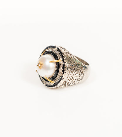 Shakuntala Ring with a South Sea button pearl framed by natural diamonds, sterling silver, and 18K gold