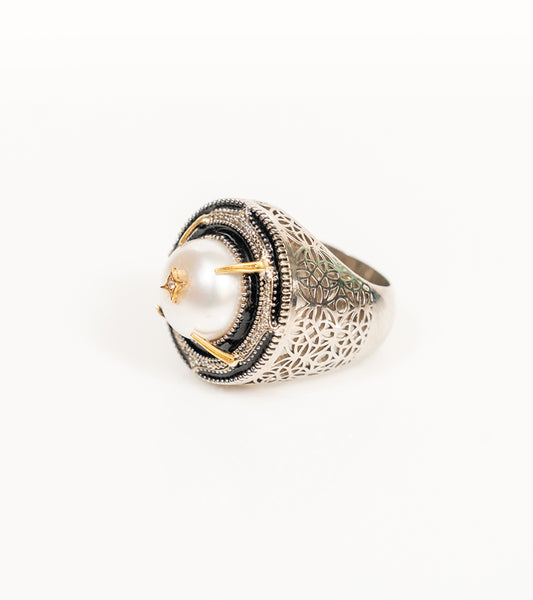 Shakuntala Ring with a South Sea button pearl framed by natural diamonds, sterling silver, and 18K gold