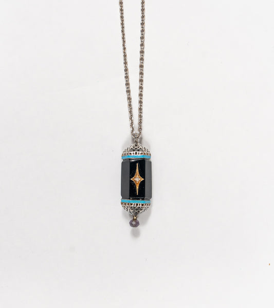 Sirius Pendant with black onyx, natural diamonds, framed in silver with 18K gold accents and hand-painted turquoise enamel