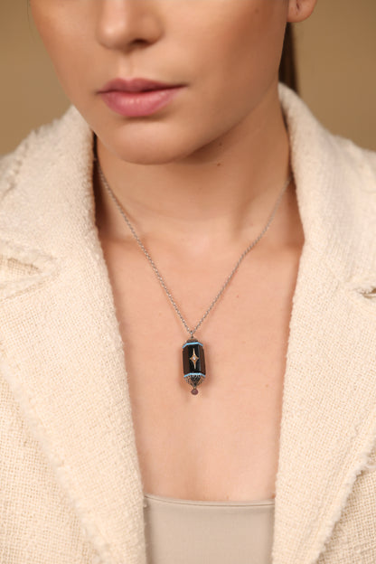 Close-up of the black onyx and diamond detailing on the Sirius Pendant