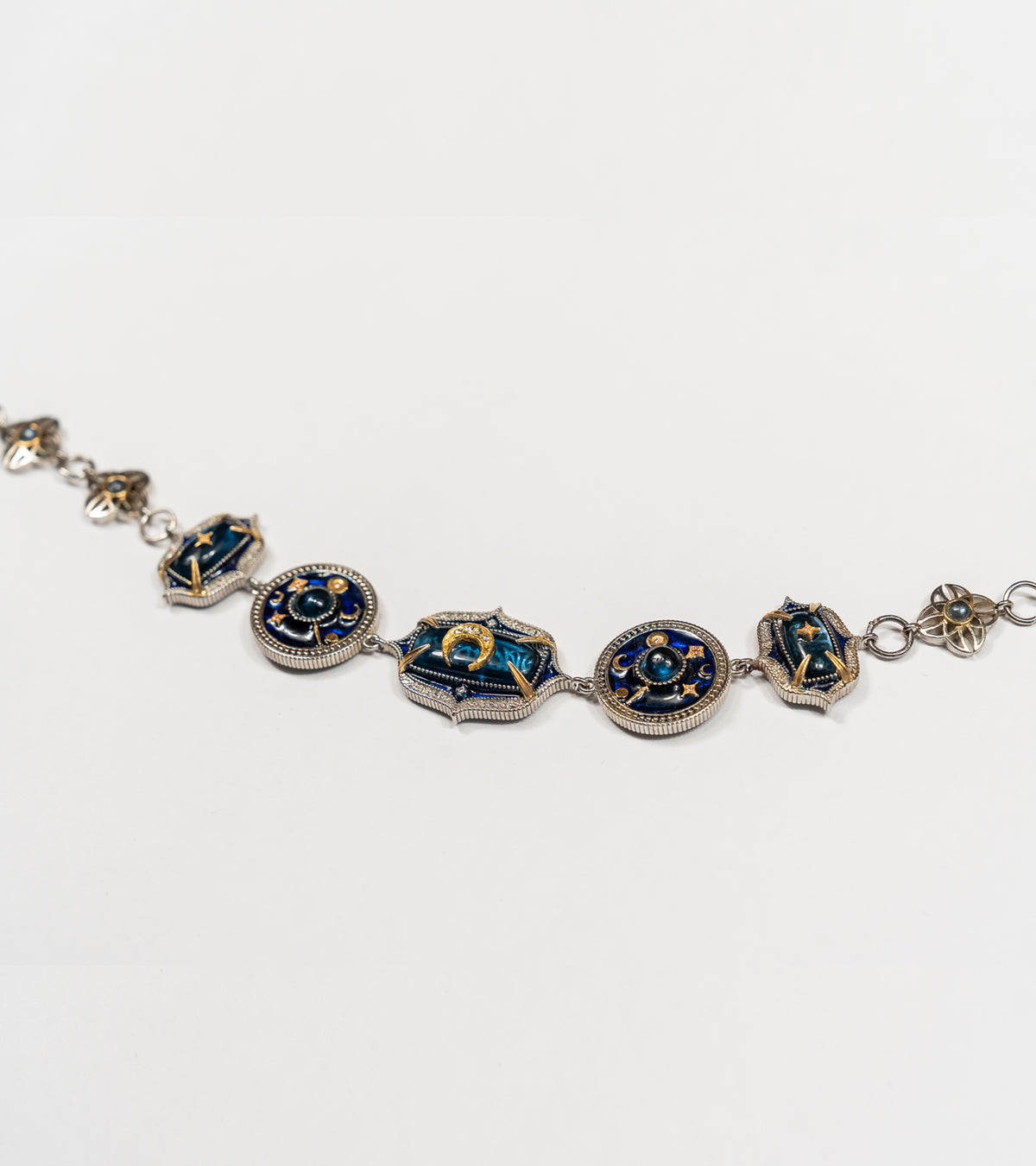 Taskan Choker in silver with 18K and 22K gold, kyanite, Polki diamonds, and hand-painted blue enamel