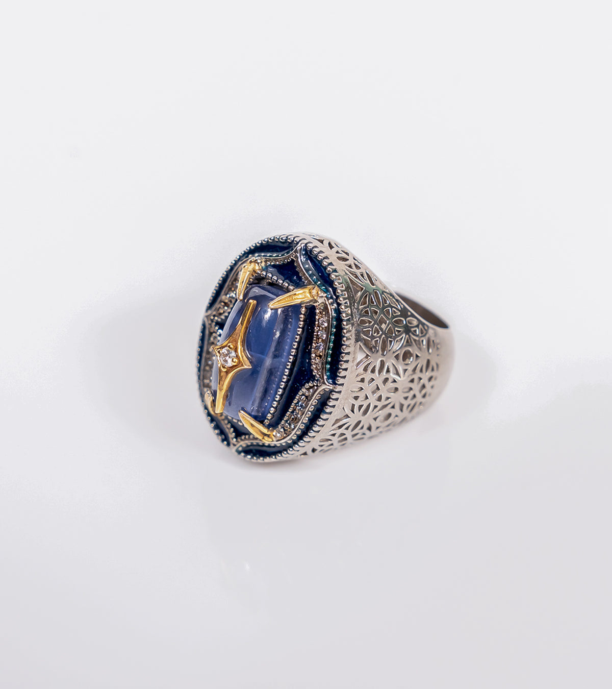 kyanite-front.jpg	Taskan Ring in blue kyanite with hand-painted enamel, natural diamonds, sterling silver, and 18K gold in an architectural silhouette
