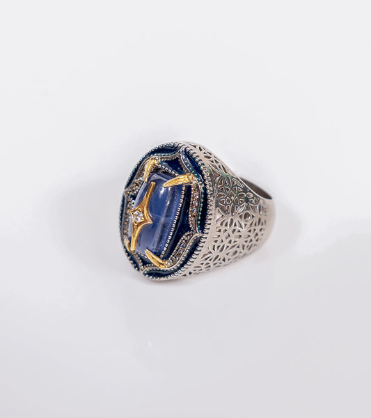 kyanite-front.jpg	Taskan Ring in blue kyanite with hand-painted enamel, natural diamonds, sterling silver, and 18K gold in an architectural silhouette