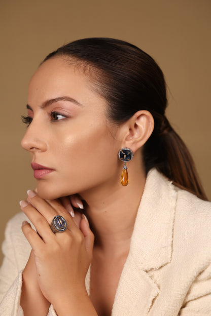 Taskan Ring worn as a signature statement piece, paired with minimal bands