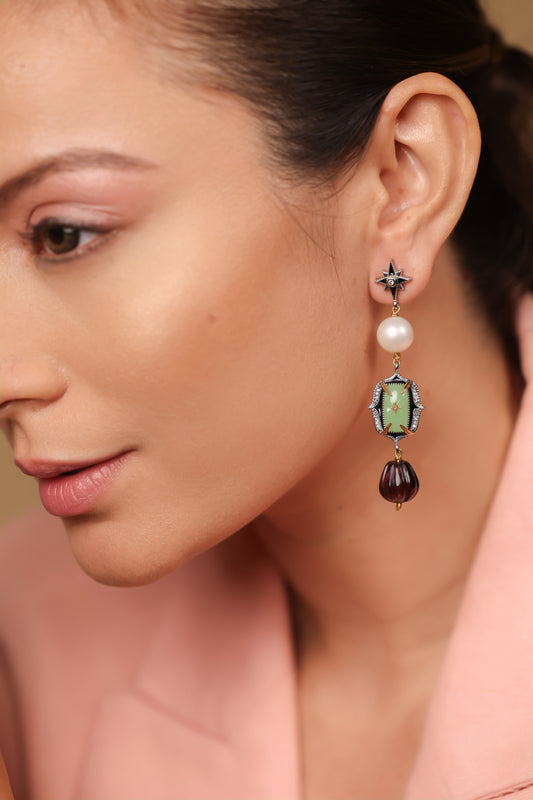Close-up of the aqua onyx and amethyst crystal detailing on the Zen Earrings