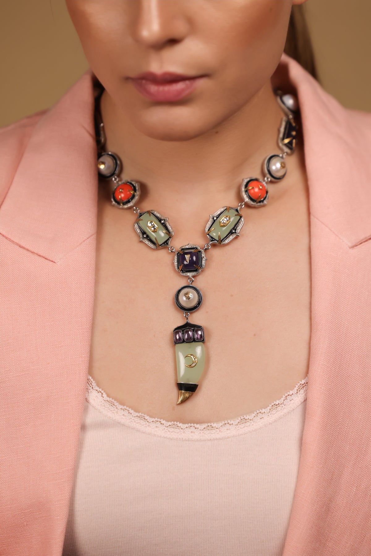 Zuri Necklace worn against a deep, dark silhouette, letting its colours take centre stage